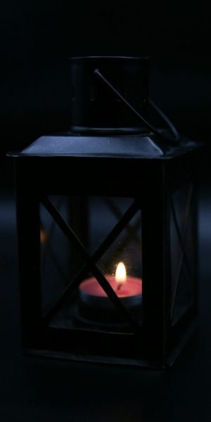 A lantern or candle in darkness